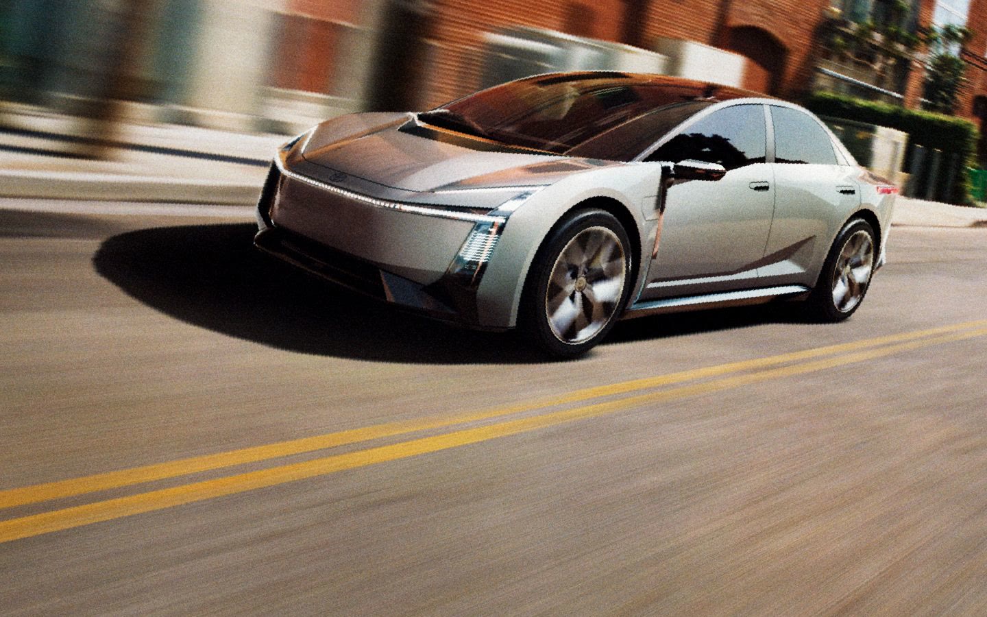 Toyota Corolla Concept prata rodando numa rua